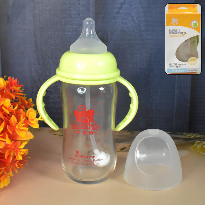 Glass baby feeding bottle with ergonomic handles and silicone nipple for easy feeding