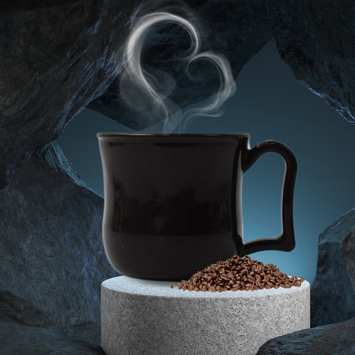 Elegant black tea cup with handle showcasing steam and coffee grounds for a cozy beverage experience