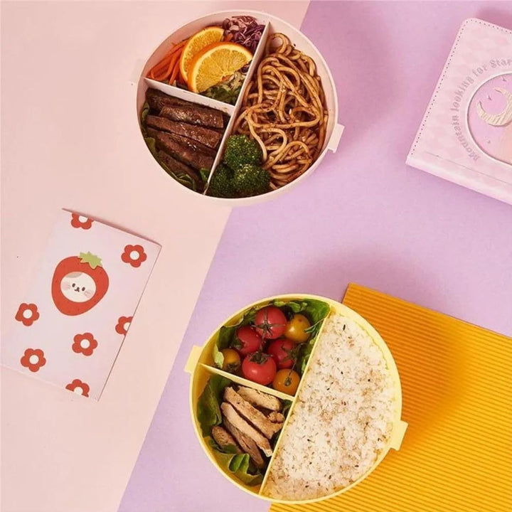 Colorful donut shaped lunch box divided for healthy meal storage with fruits and vegetables