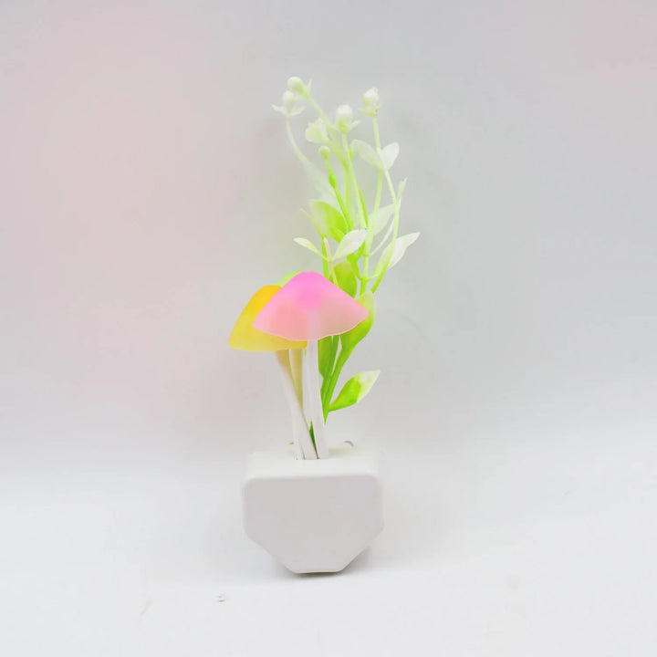 Fancy LED illumination light in decorative pot with vibrant mushroom design and faux greenery