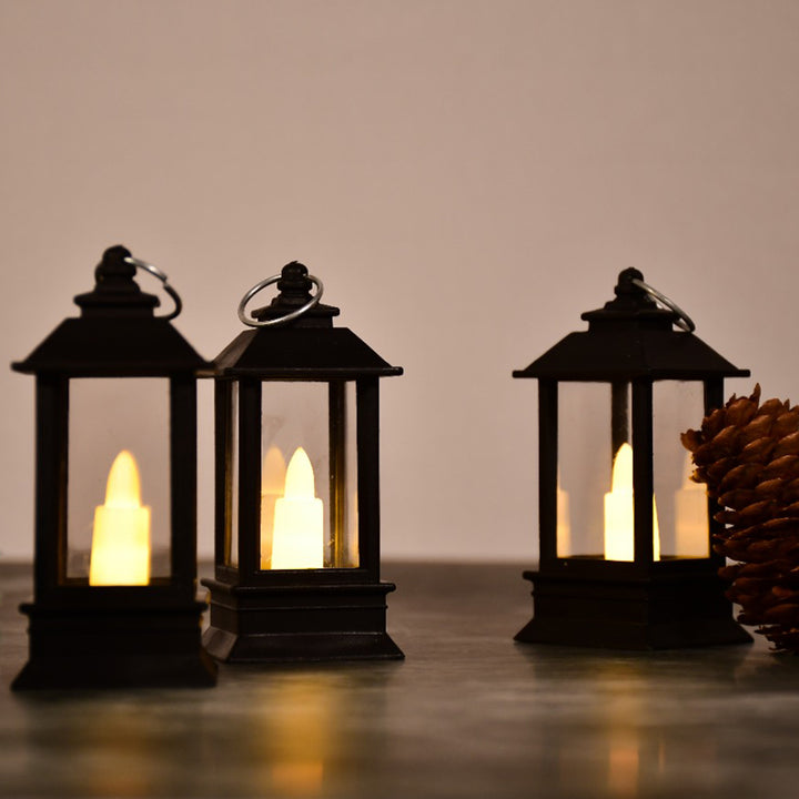 Flameless candle lantern pack featuring three elegant black lanterns with realistic flickering lights