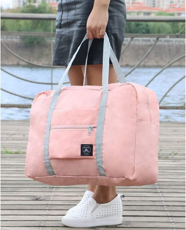 Superior eMart Foldable Duffel Bag in Pink with sturdy handles and front zipper pocket