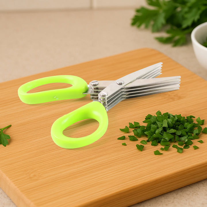 Superior eMart 5-blade kitchen scissors with green handles cutting chopped herbs on wooden board