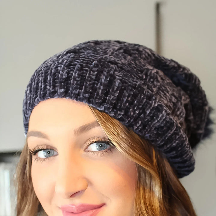 Girls winter cap cozy in a stylish dark color, perfect for keeping warm during cold months