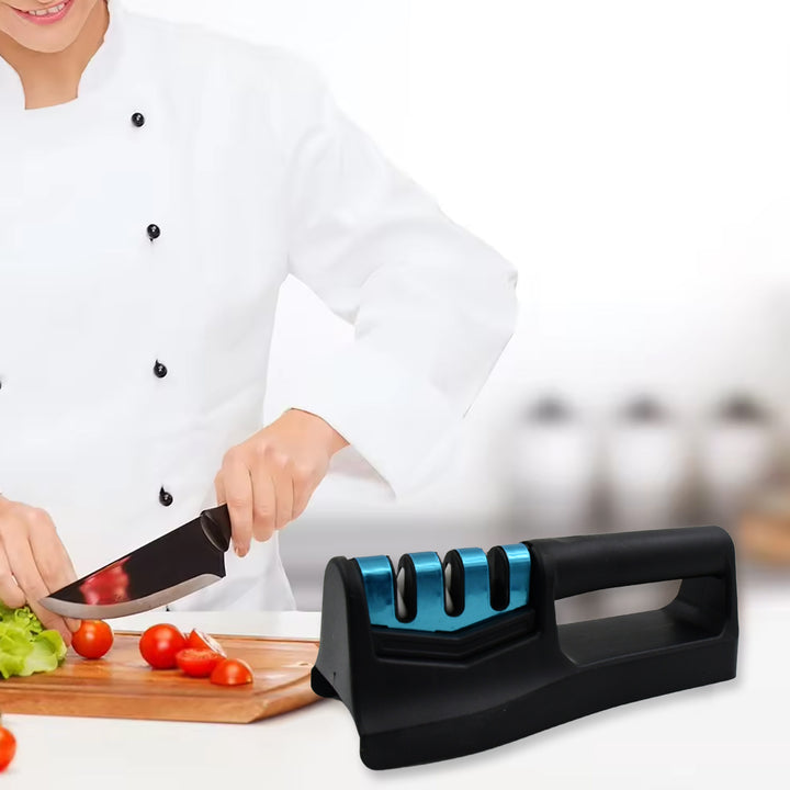Professional chef using a handheld knife sharpener for precise and efficient knife maintenance in the kitchen