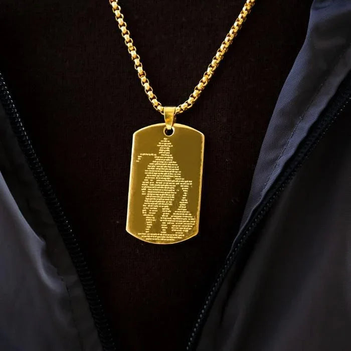 Gold Hanuman Chalisha pendant on a chain showcasing intricate design and spiritual significance