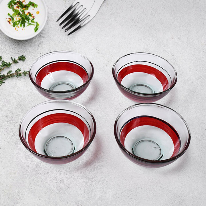 Clear glass bowls with red and white stripes set on a kitchen counter from Superior eMart ceramic cup and glass bowl set
