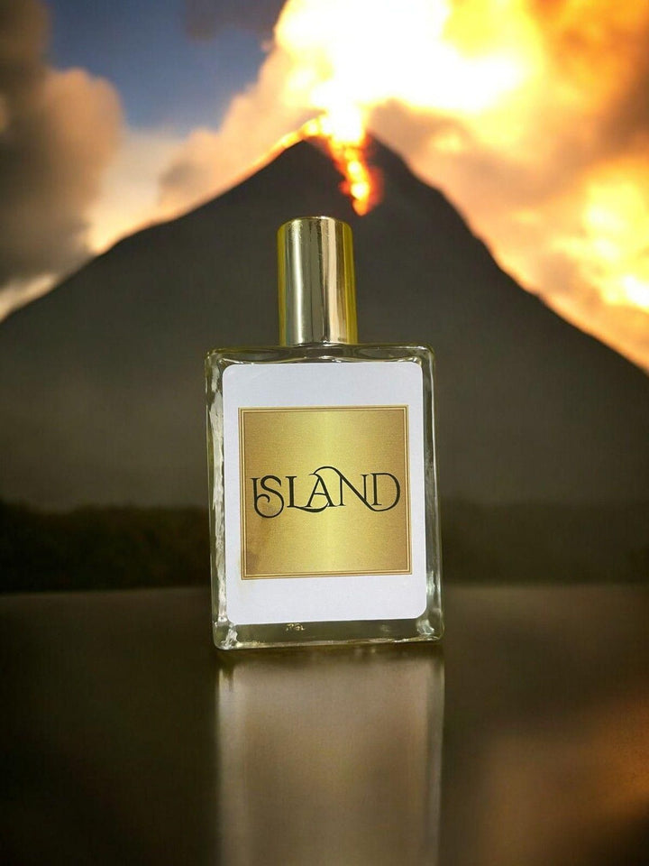 Island perfume 50ml bottle with gold label and cap in front of a volcanic eruption background