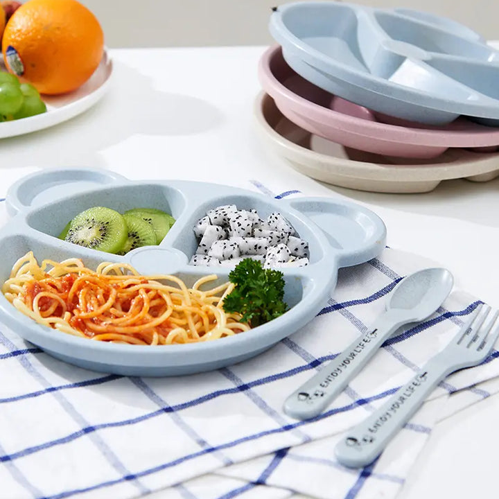 3 compartment kids plate in blue with pasta, kiwi, and dragon fruit, perfect for fun mealtime