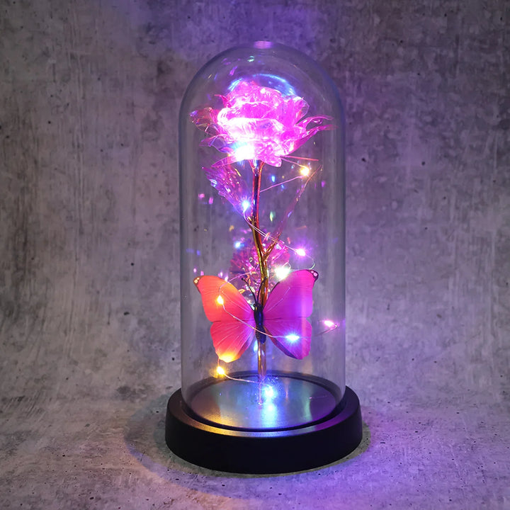 LED rose dome decoration with a colorful illuminated rose and butterfly inside a glass display case