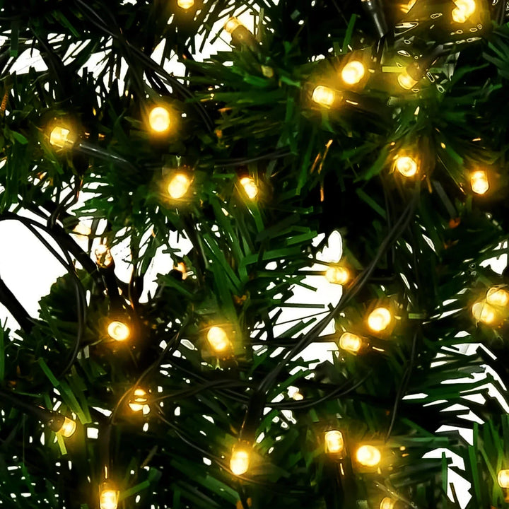 Superior eMart LED string lights 10 meter intertwined with green foliage for festive decoration