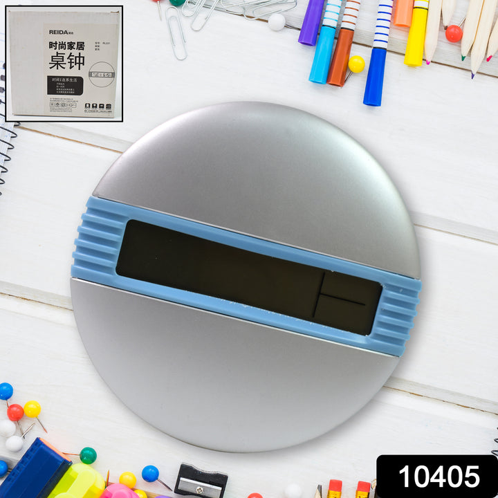 Minimalist desktop alarm clock with a round silver shape and blue digital display from Superior eMart