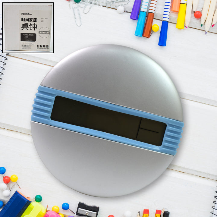 Superior eMart minimalist desktop alarm clock with silver round design and blue digital display on white desk