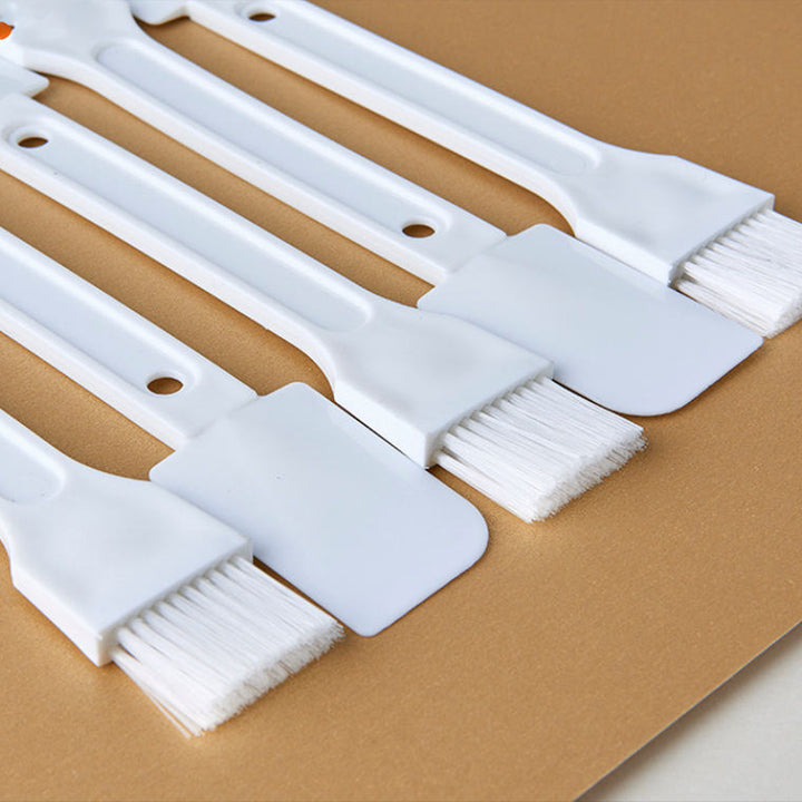 Set of multi-purpose cleaning brushes with varying brush head shapes for versatile home cleaning tasks