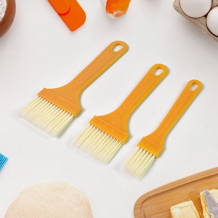 Multifunction basting brush set in vibrant orange color for easy baking and cooking applications
