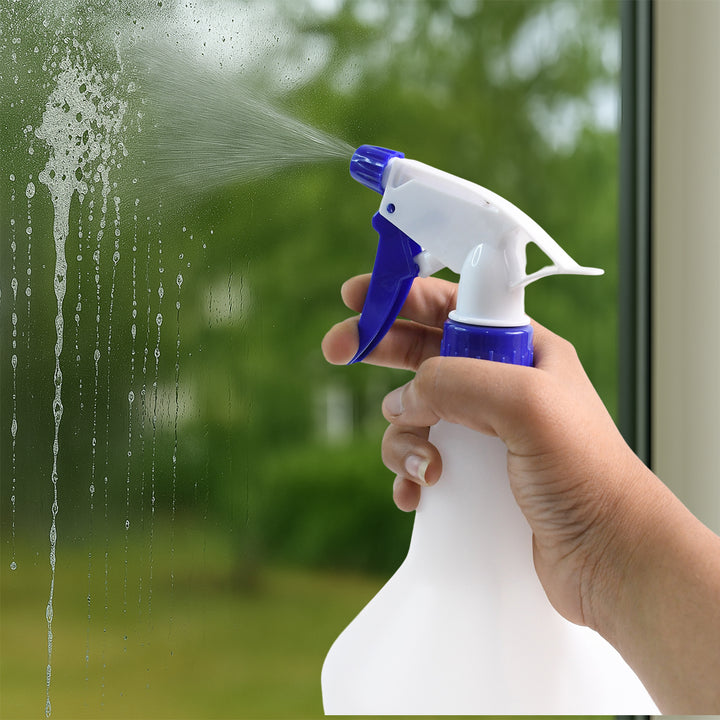 Hand holding a Superior eMart multipurpose spray bottle 1L for cleaning windows and other surfaces