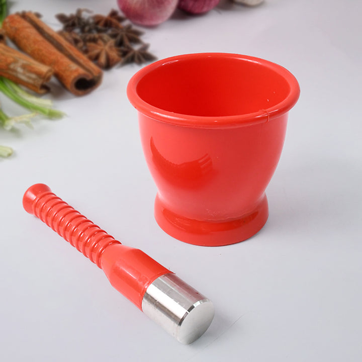 Red unbreakable khal batta for kitchen with textured handle and stainless steel end for superior grinding