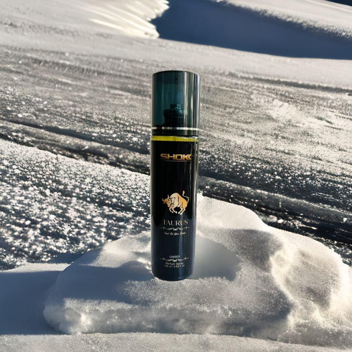 Guardian Taurus body spray by Superior eMart standing on snow with a clear black and gold bottle design