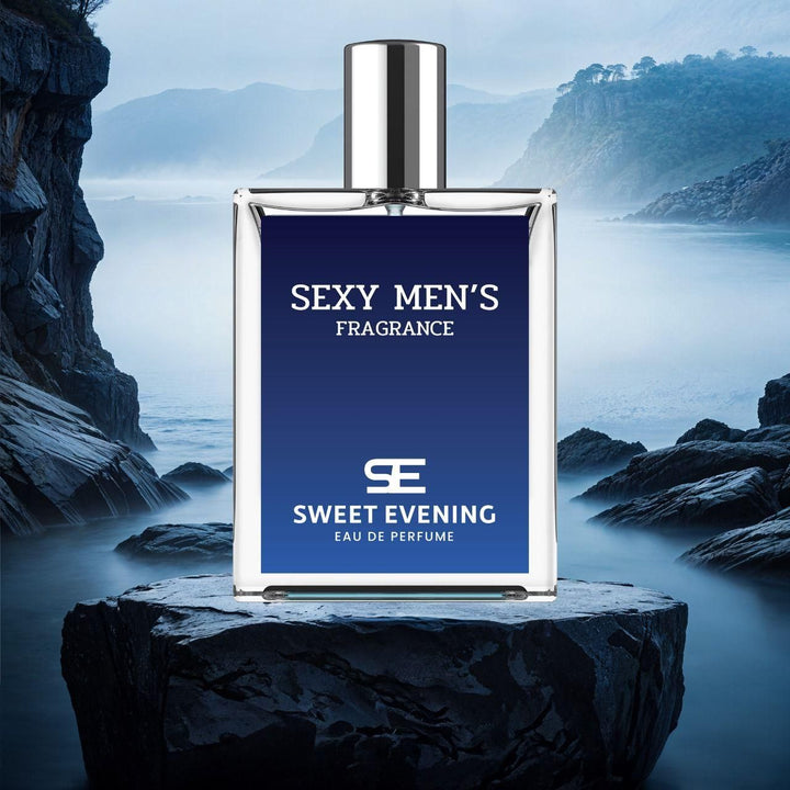 Sexy men's fragrance 100ml pack Sweet Evening eau de perfume bottle with blue label on rocky surface