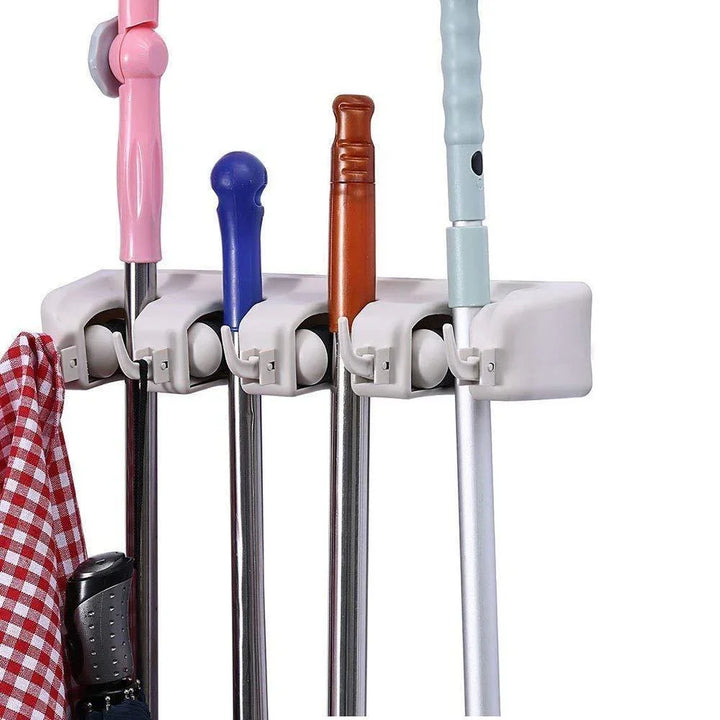 Wall mounted mop organizer with multiple slots for efficient storage of mops and cleaning tools