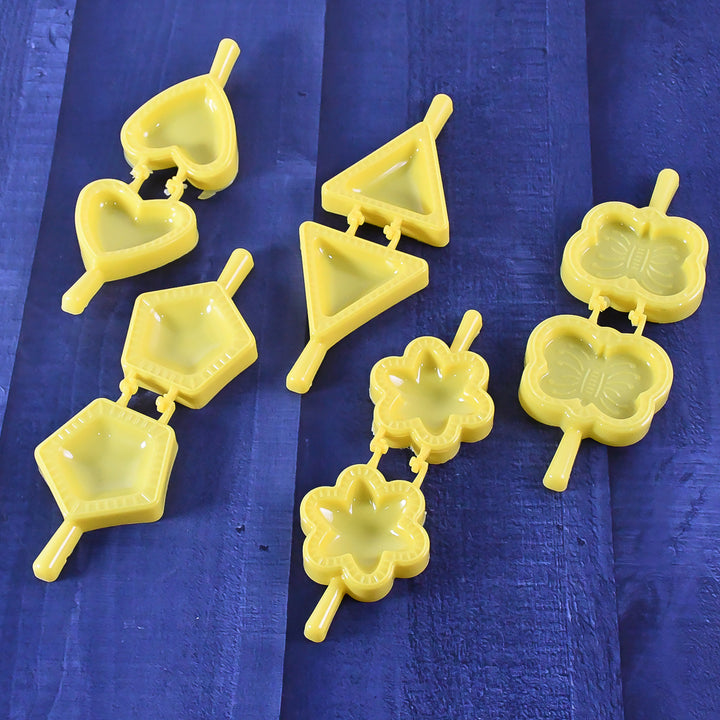 Superior eMart 6 piece cookie mold kit with yellow plastic shapes including heart, triangle, flower, and butterfly