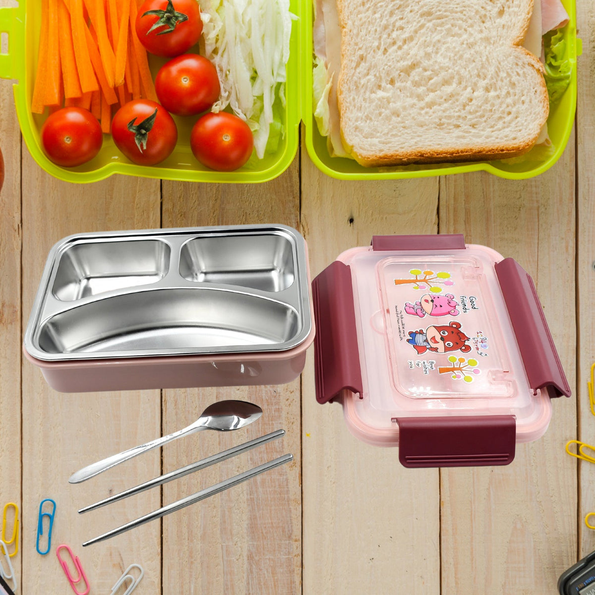 Kids' lunch box with steel spoon and chopsticks, made from food-safe materials.