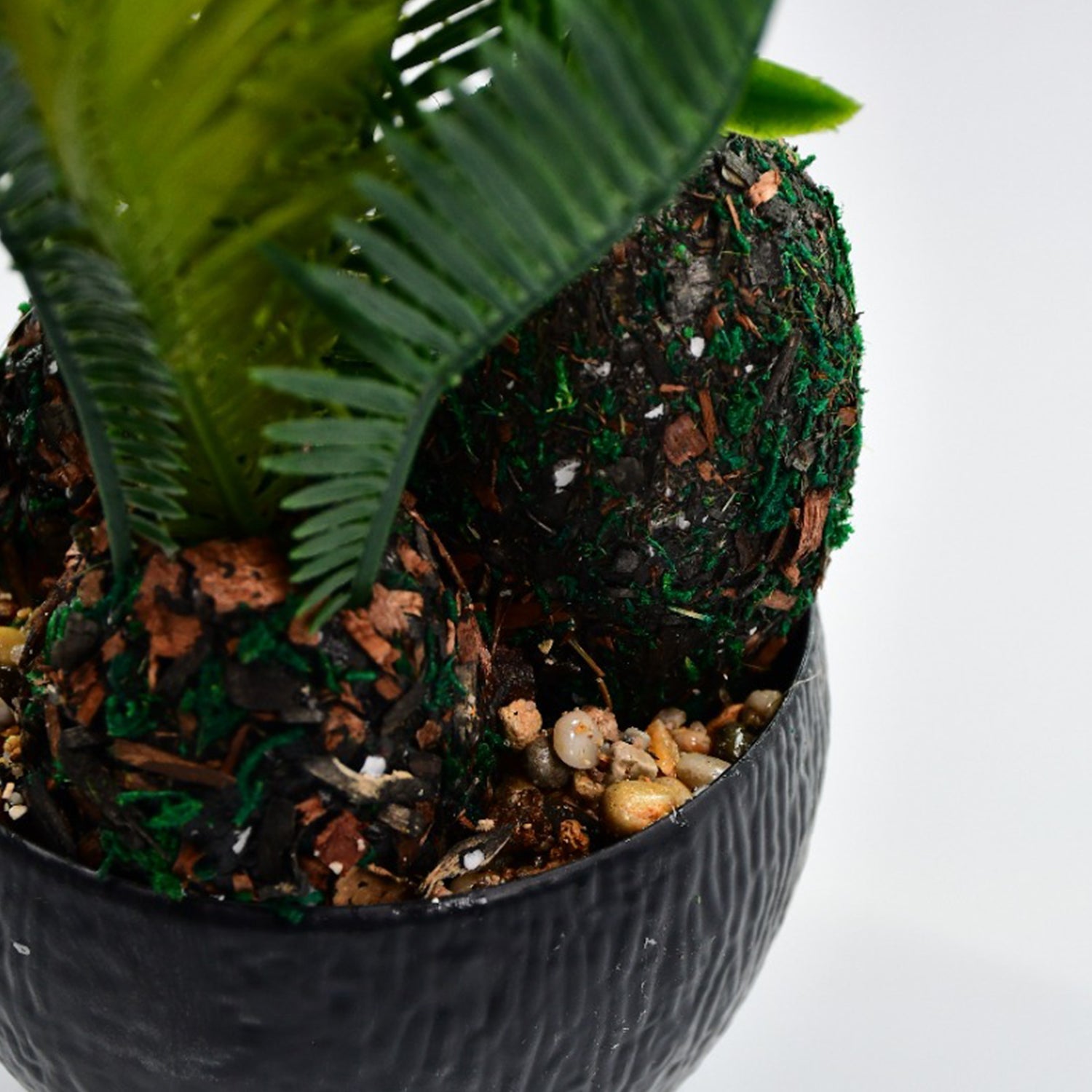 Pot with artificial plant and realistic appearance