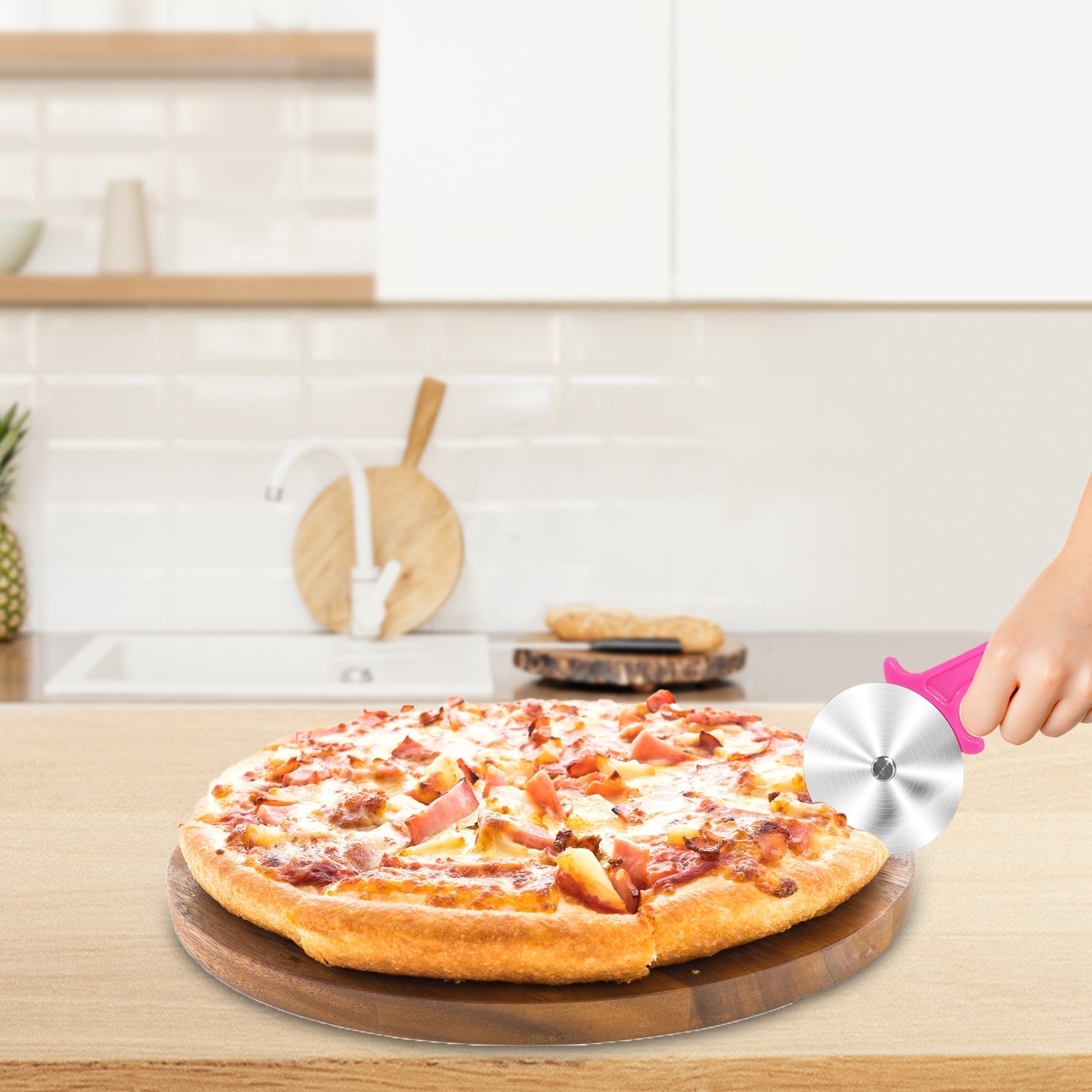 Stainless steel cutter for pizzas and sandwiches.