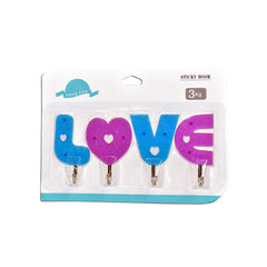 Set of love-shaped self-adhesive hooks for home decoration.