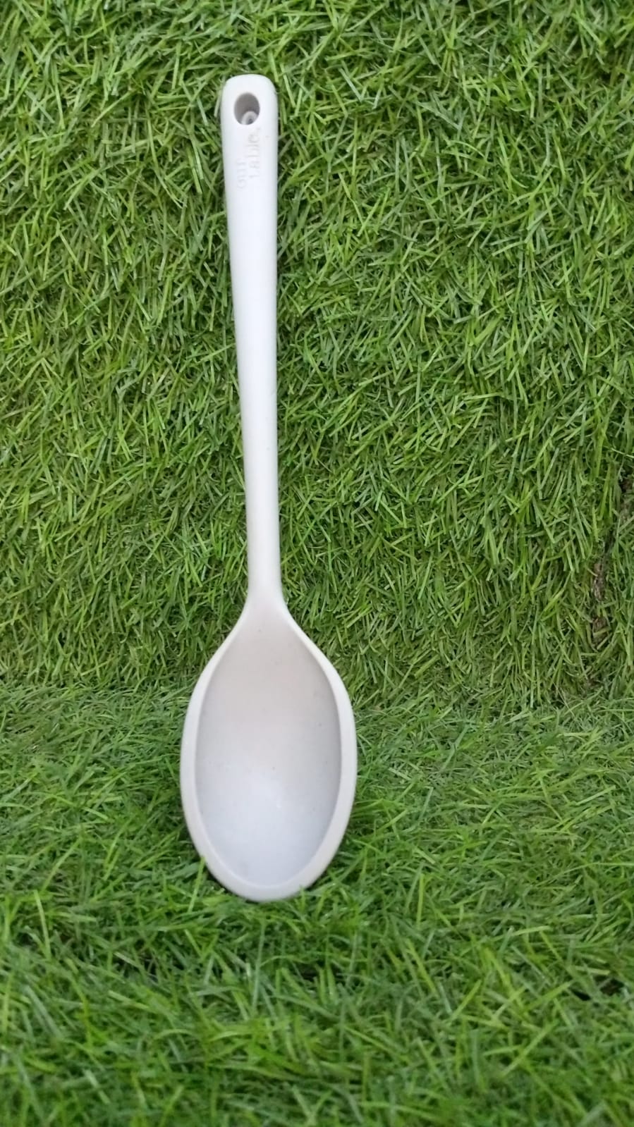 Heat resistant large silicone spoon, 32 cm, for use in the kitchen.