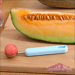 2-in-1 fruit peeler and baller next to melon slice for easy fruit preparation