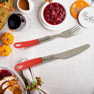 Colorful 26-piece dining table cutlery set with red handles, perfect for festive meals and gatherings