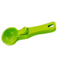 Green plastic ice cream scoop, single piece.