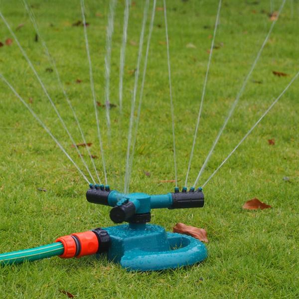 3 arm garden sprinkler in green on grass with adjustable spray settings for efficient watering