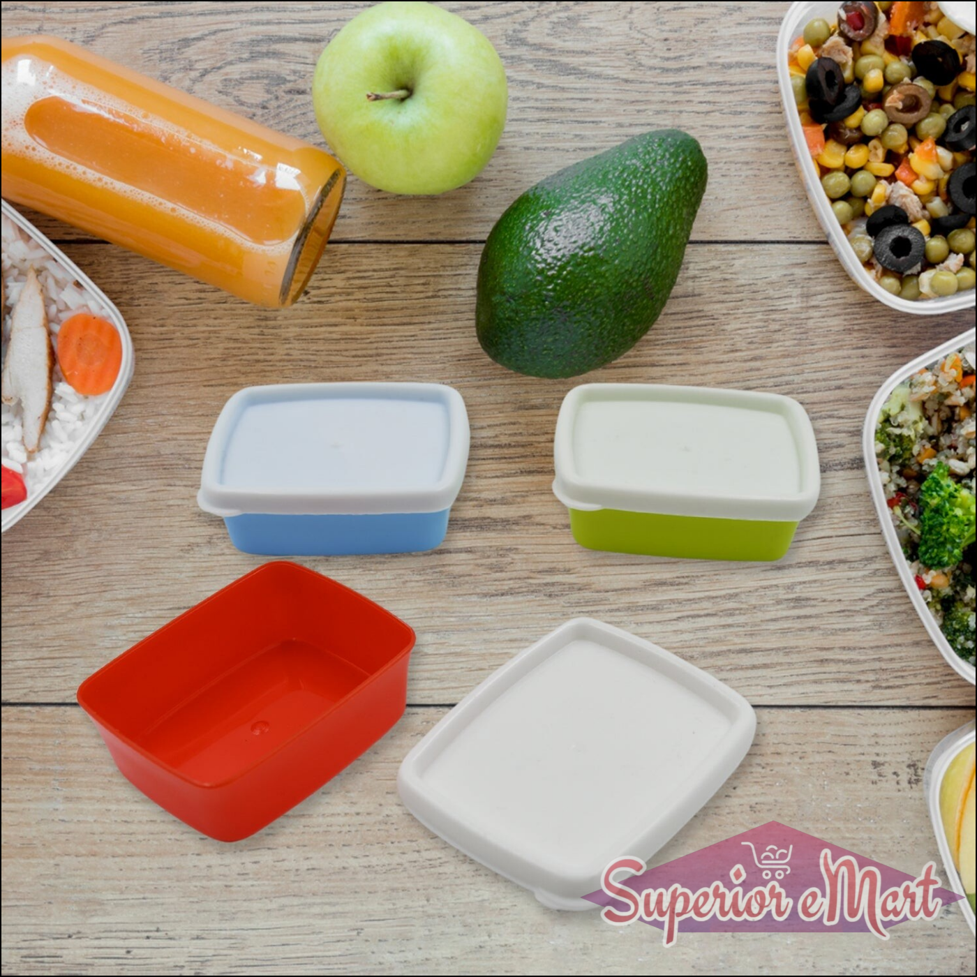 Airtight food storage containers set in various colors with fresh vegetables and healthy meals on a wooden table