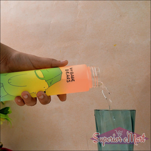 Cute cartoon water bottle being filled with water next to a glass, featuring vibrant design