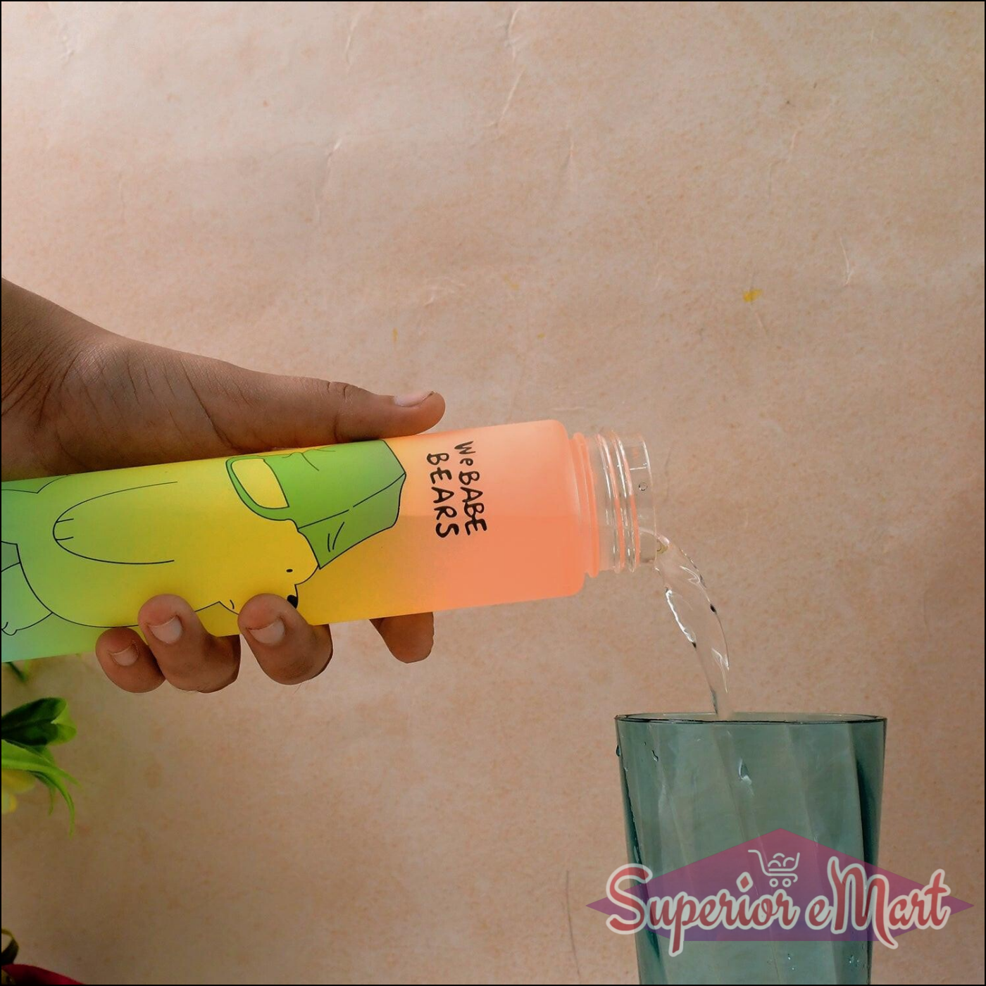 Cute cartoon water bottle being filled with water next to a glass, featuring vibrant design