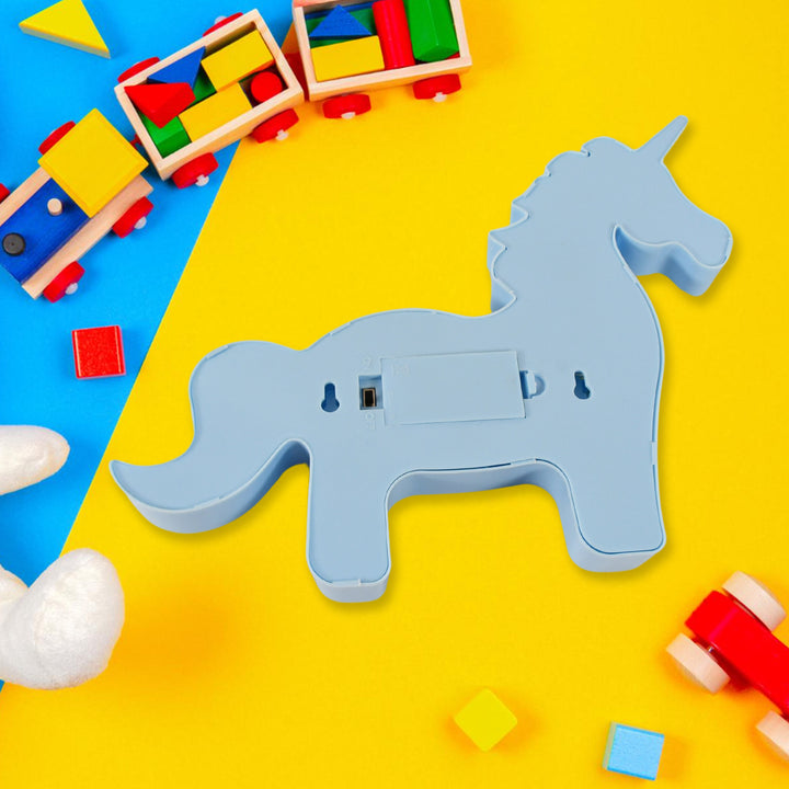 3D LED Unicorn night light for kids in blue with fun toys and colorful blocks in the background