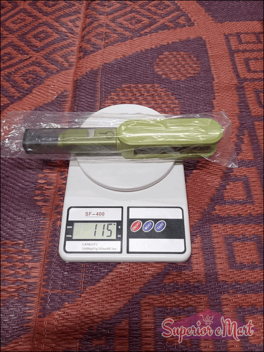Green kitchen scale with a digital display on a patterned surface