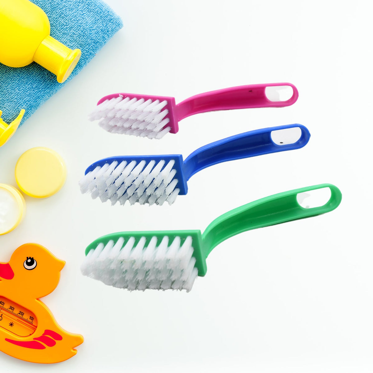 Set of three multi-purpose kitchen cleaning brushes for fish and vegetables.