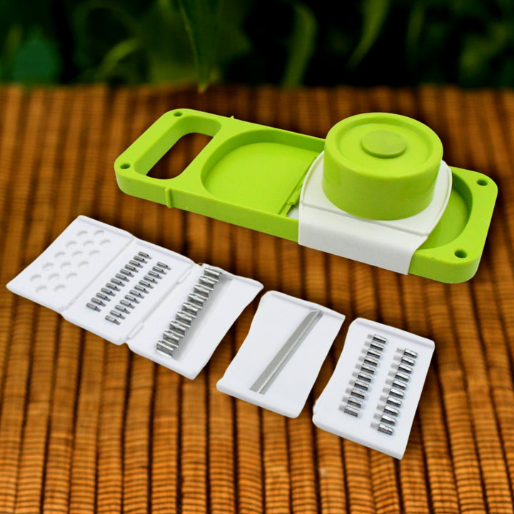 5 in 1 vegetable slicer in green with multiple blade attachments for versatile food preparation