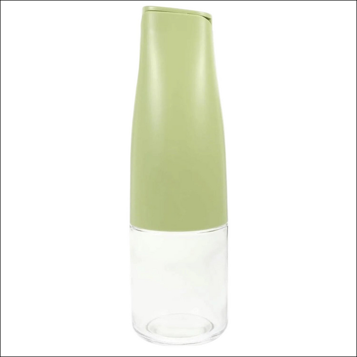 Automatic oil dispenser for kitchen with a sleek green top and clear bottom for easy viewing