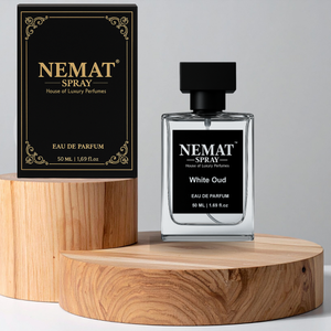 Nemat White Oud 50ml Eau de Parfum spray in clear glass bottle with black cap, next to its black and gold box.