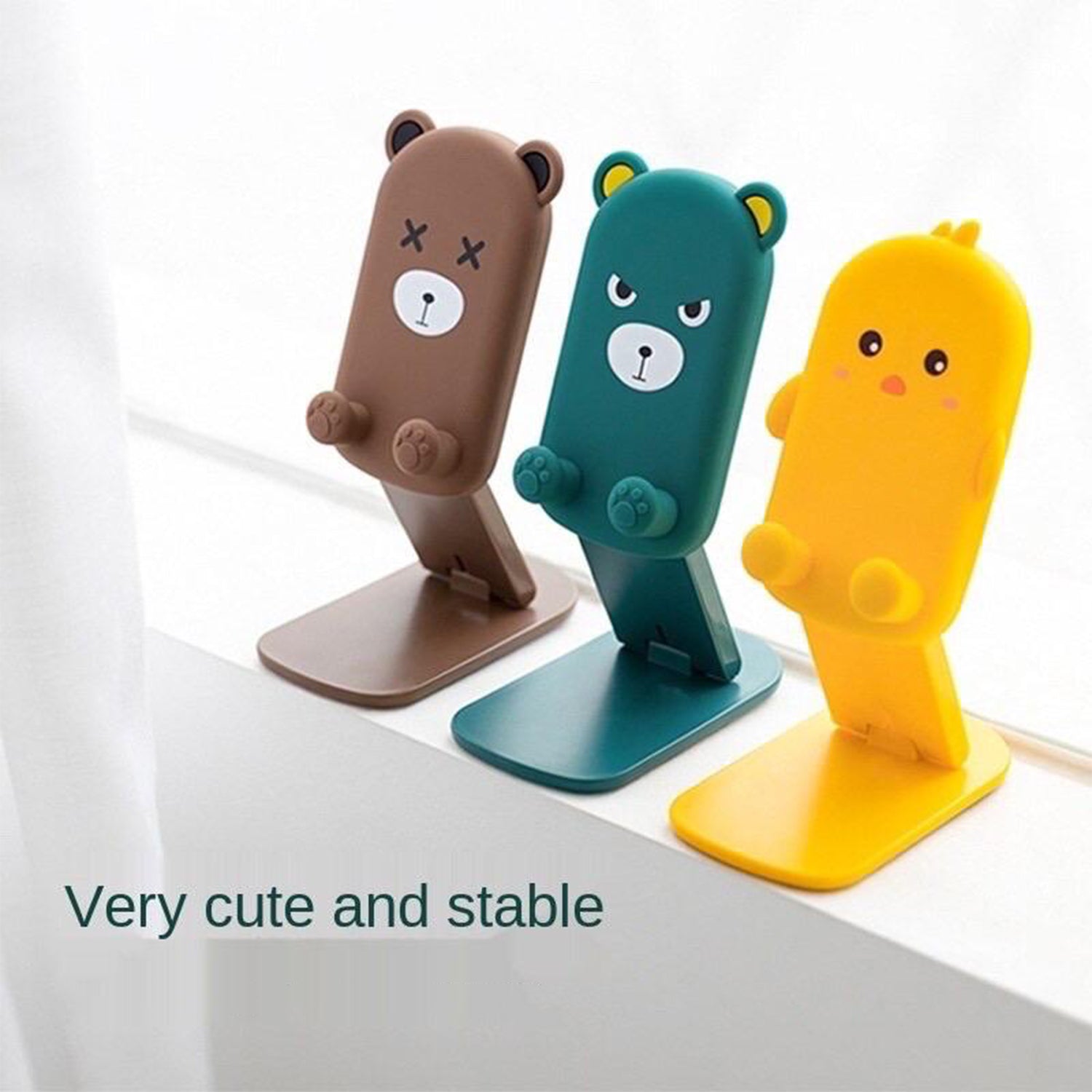 Compact and foldable mobile stand with a playful cartoon design, demonstrating its portability and function