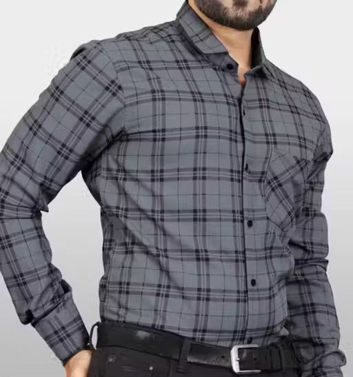 Gray plaid shirt worn by a person on a plain background