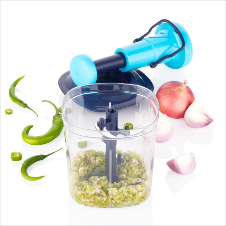 Manual vegetable chopper in blue with chopped green peppers and onions in the container