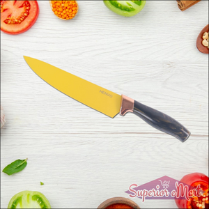 Professional kitchen knife set displayed with fresh vegetables and herbs on a wooden countertop