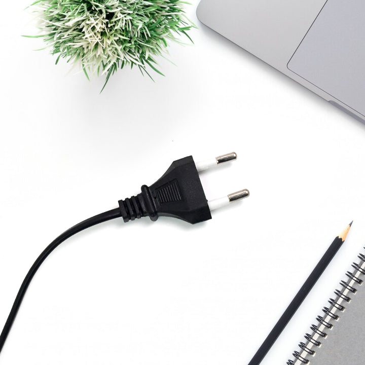 60W hot glue gun power cord with a plant and stationery on a desk