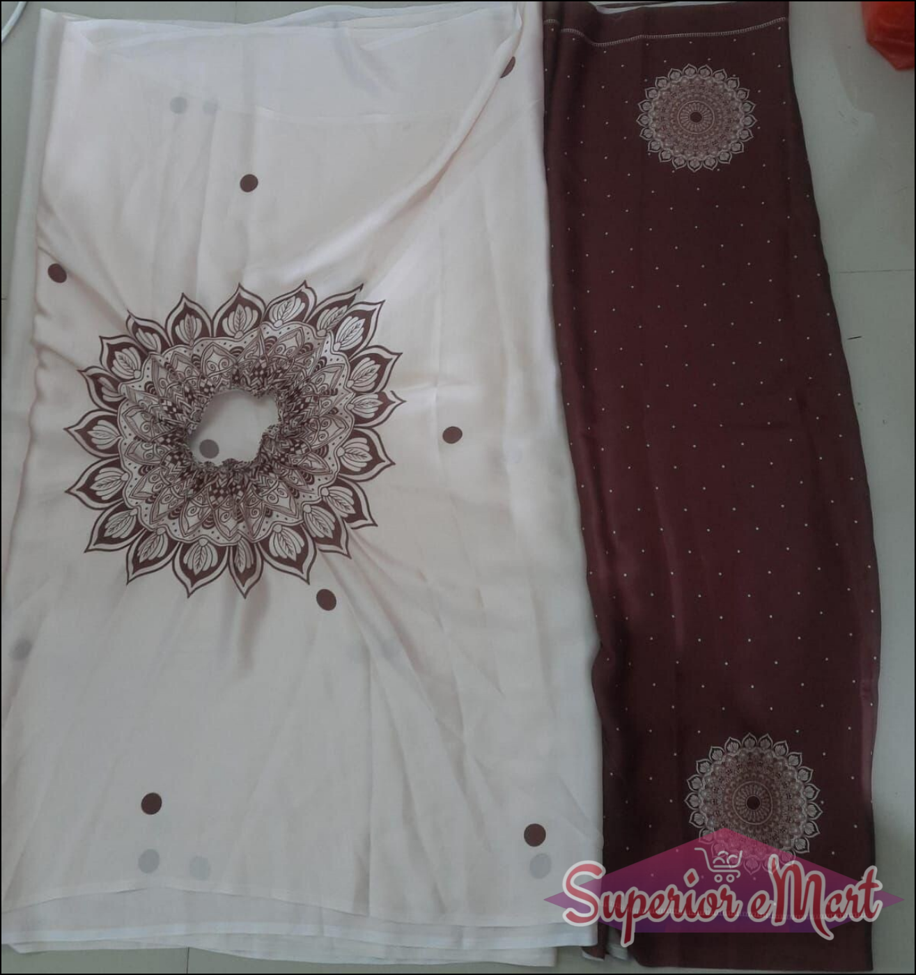 Off-white fabric with a maroon mandala and dots next to maroon fabric with white polka dots and mandala designs.