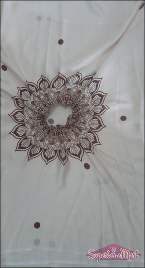 Off-white garment with a brown mandala print around a gathered neck and scattered brown polka dots.